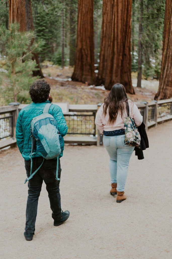 Gina and Victor, a couple, walking along the trail to the Grizzly Giant 