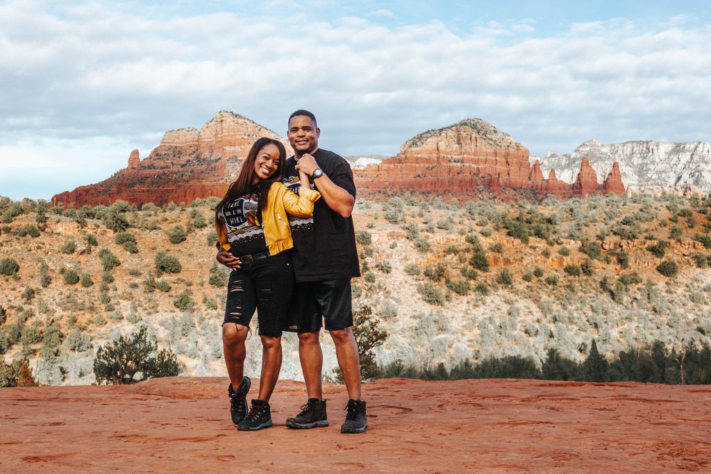 Couple standing on the trail during a cathedral rock engagement session