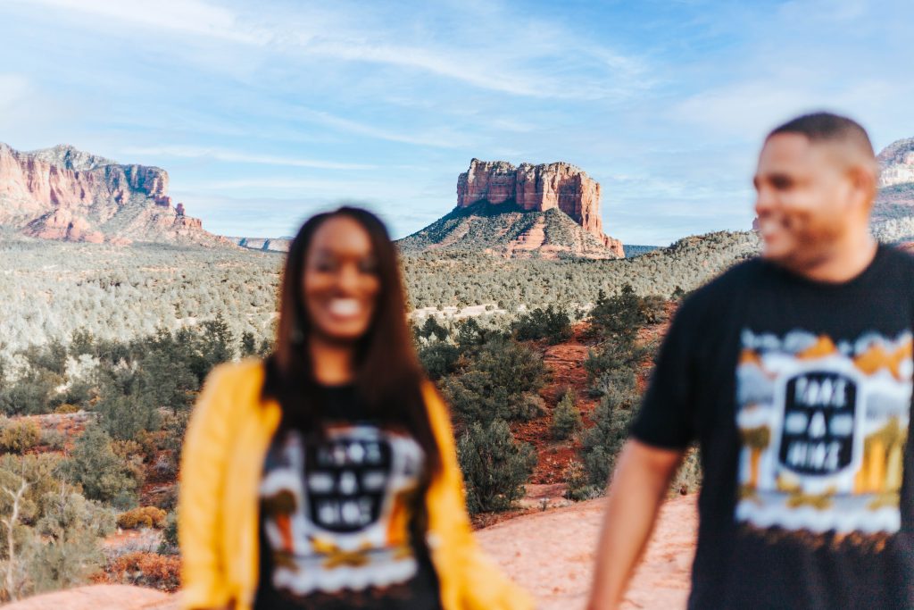 Couple standing on the trail during a cathedral rock engagement session 